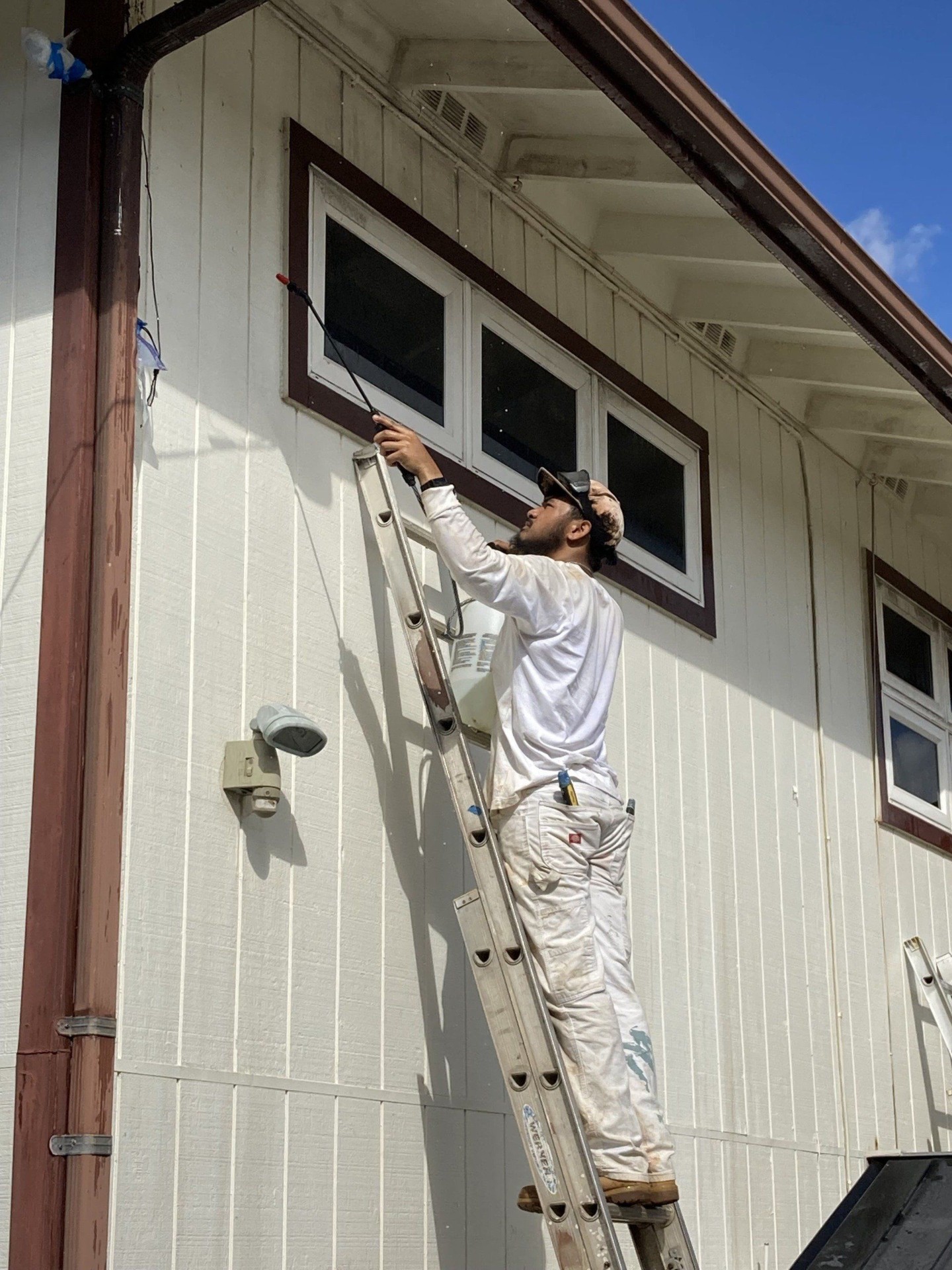 Canencia painter finishing interior trim in a Mehana townhome